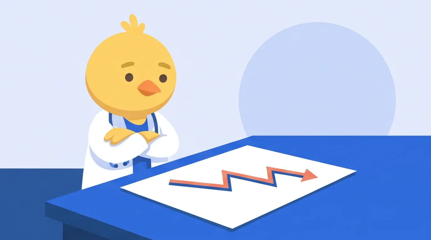 ヒヨコの医師が、急に大きく下がった折れ線の描かれた紙を机に広げ、腕を組んで落ち着いて見つめている